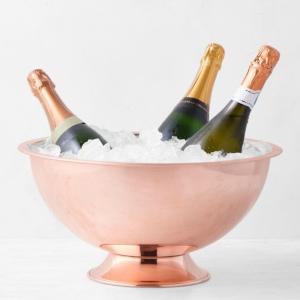 This premium stainless steel champagne bowl is engineered with an elegant pedestal base elevating your luxury tabletop beverage presentation during high end catering events. 3